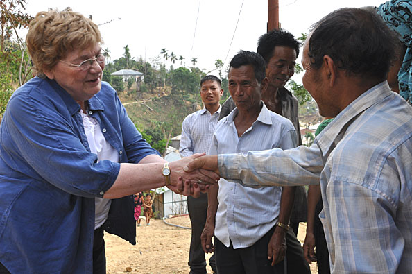 Sandy greeted by the village leaders