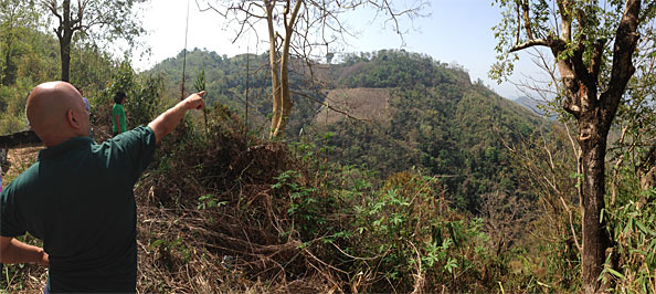 John Pudaite pointing to Sesawng Mountain